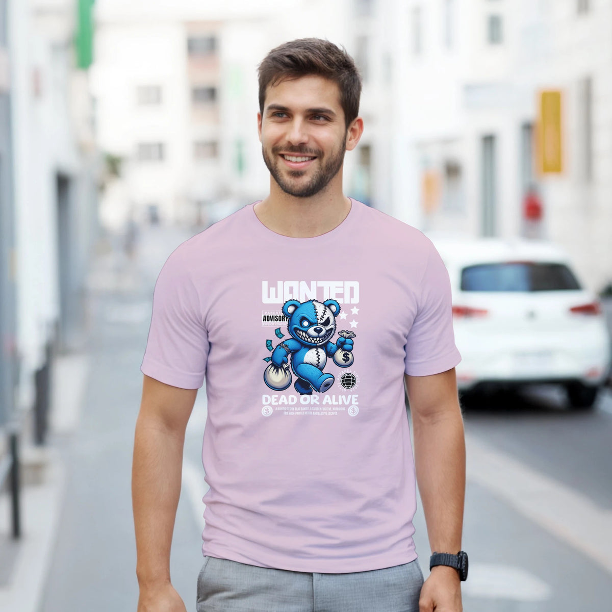 Man in pink Teddy Bear graphic T-shirt featuring a blue bear and Dead or Alive print, casual streetwear