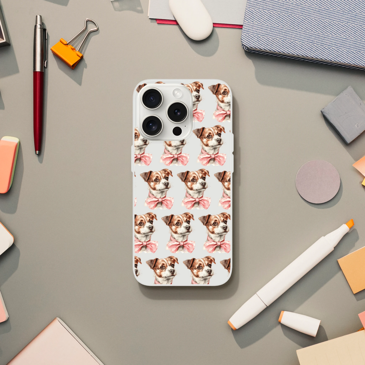Slim transparent iPhone case for 13-16 with a repeating pattern of cute brown-and-white puppies wearing pink bows.
