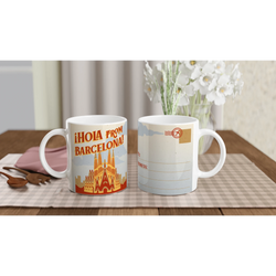 Two vintage Barcelona mugs with retro postcard artwork on a table beside white flowers.