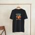 Black women's graphic T-shirt with California Beach Paradise palm trees sunset design on soft cotton blend fabric.