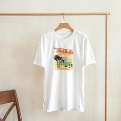 White women's short-sleeve crew-neck T-shirt with Tropical Dreamer palm-tree sunset graphic.
