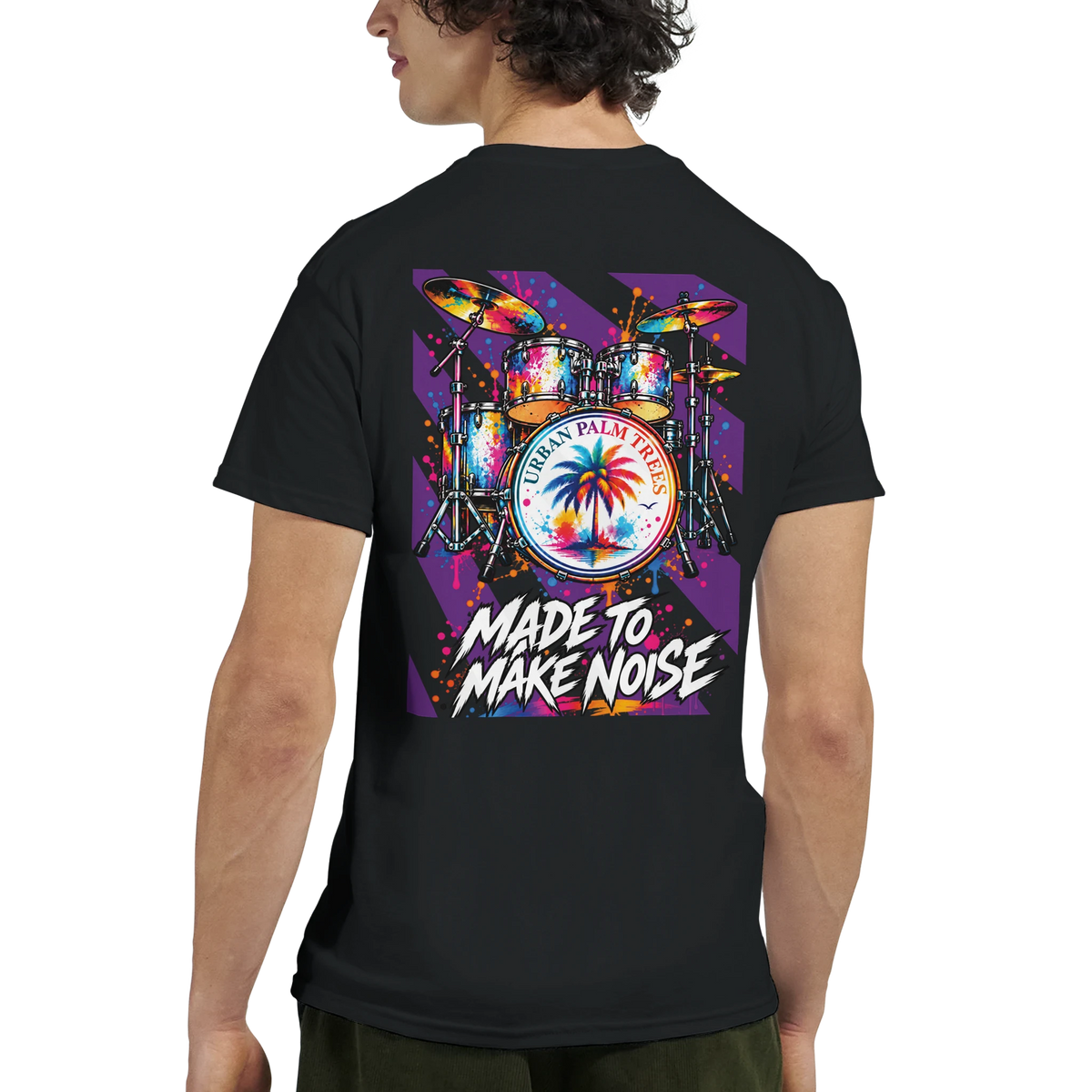 Black t-shirt back print featuring a colorful retro drum kit graphic with a palm tree and "Made To Make Noise" text.