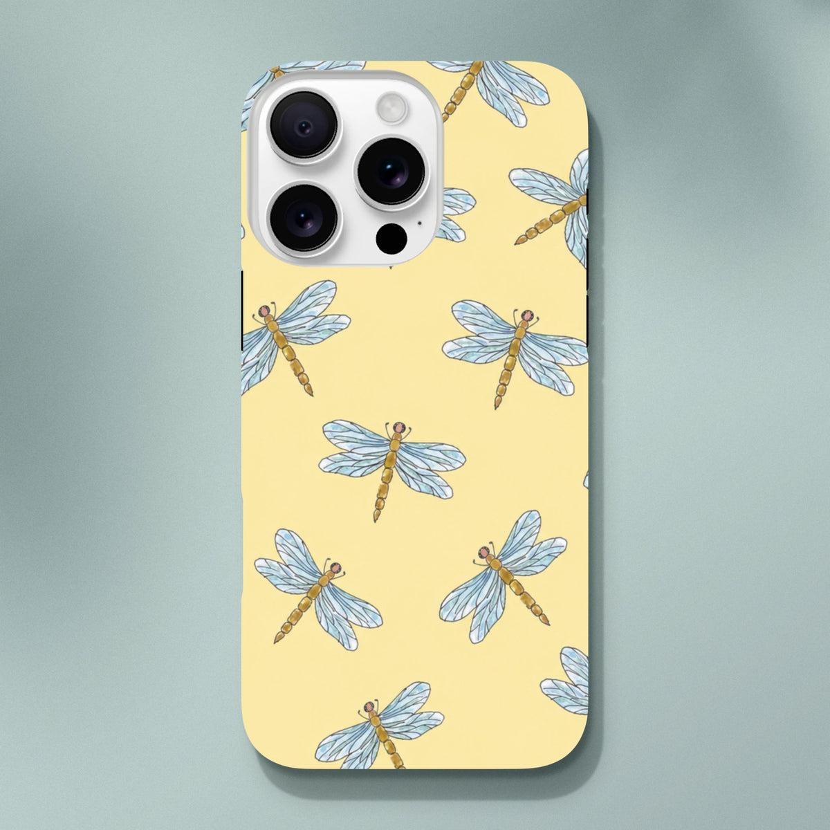 Yellow iPhone case featuring a repeating pattern of blue-winged dragonflies on a soft yellow background for drop protection.