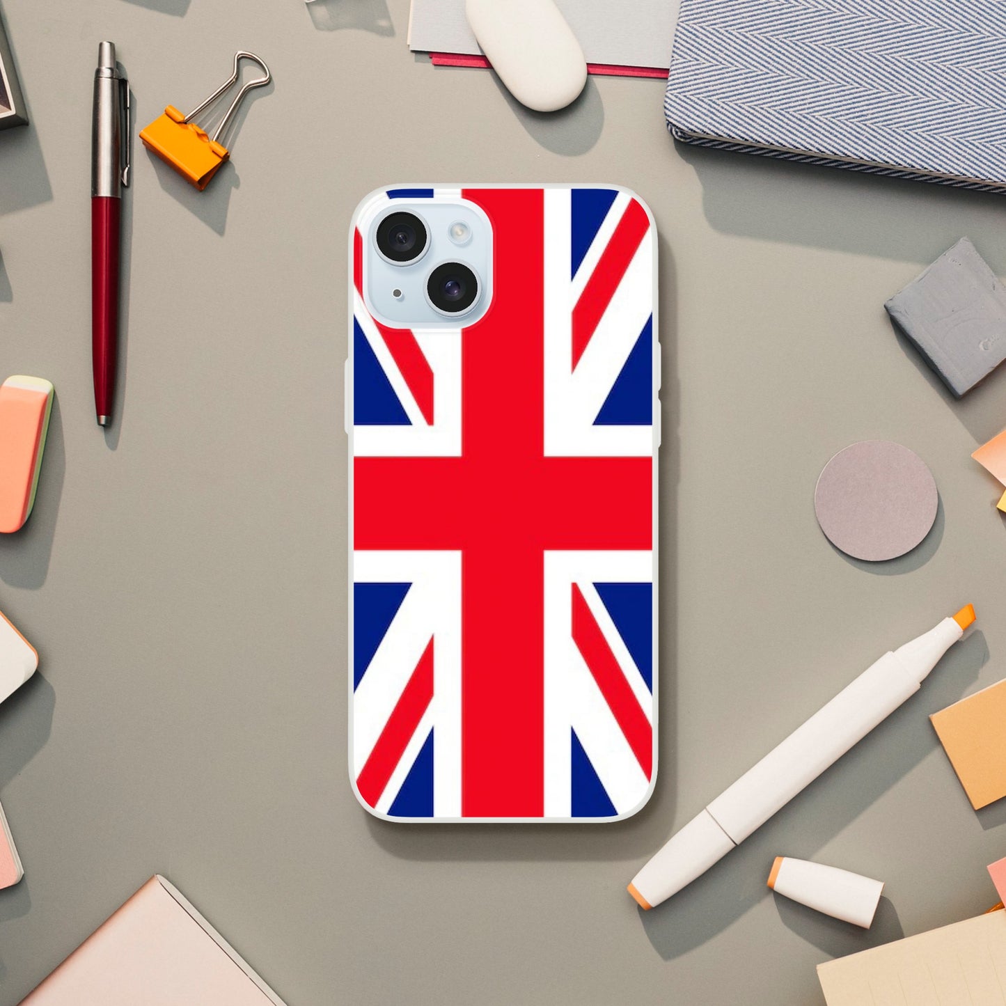 iPhone case with British flag design on a desk with office supplies 26