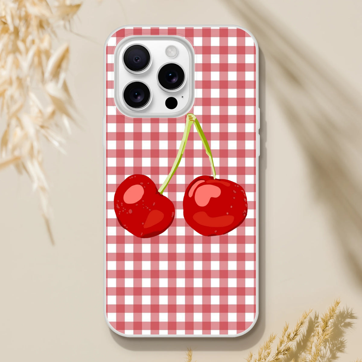 Cute Cherry Gingham iPhone case (13-16) with red cherries on a red-and-white gingham pattern, Coquette aesthetic.