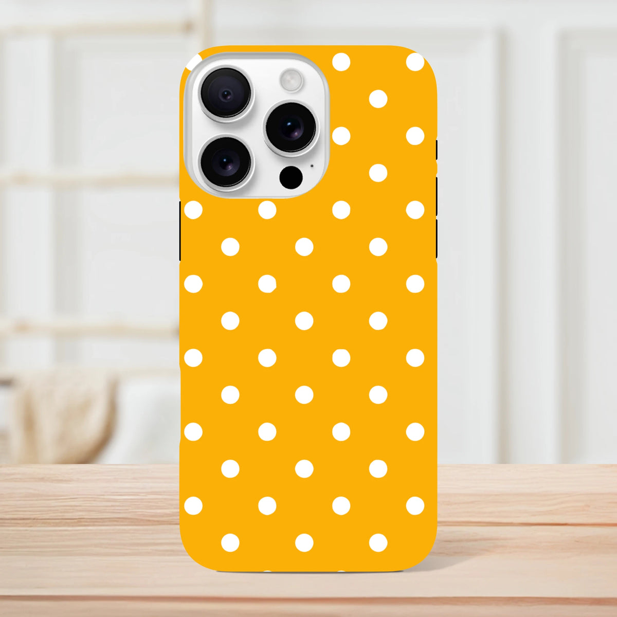 Orange and white polka dot tough iPhone case with shock-absorbing dual-layer TPU shell for iPhone 13-16.