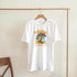 White cotton-blend women's Tropical Cocktail graphic T-shirt with colorful island cocktail print.