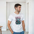 Man wearing white Sakura graphic T-shirt with bold cherry blossom print and crew neck.