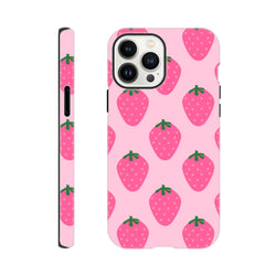 Pink tough iPhone case featuring a cute repeating strawberry pattern with green stems and glossy finish for reliable protection.