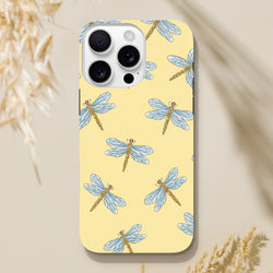 Yellow iPhone case featuring a blue and gold dragonfly pattern on a pale yellow background for durable protection.