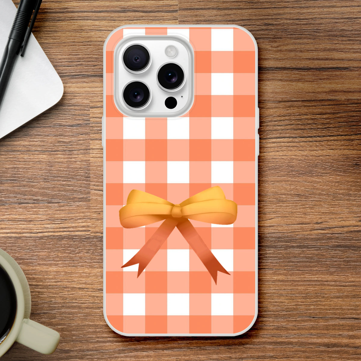 Orange gingham bow iPhone case for iPhone 13-16, cute coquette aesthetic with vibrant vintage-inspired style.