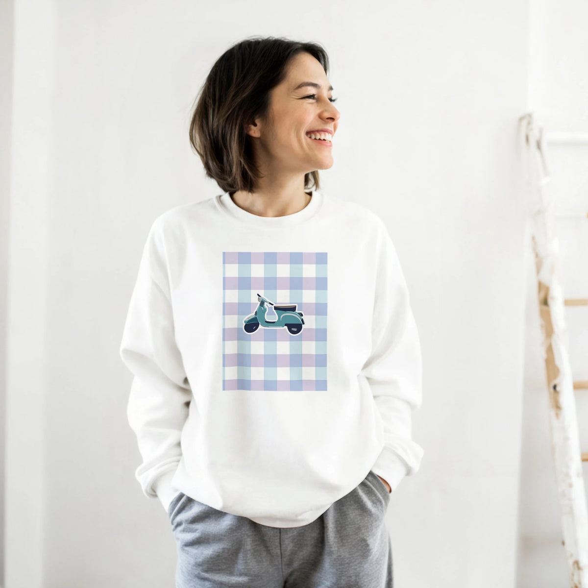 White women's sweatshirt featuring a retro scooter graphic inside a pastel gingham square. Vintage mod style jumper.