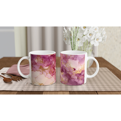 Two blush pink marble mugs with rose-gold abstract veining and white handles on a checkered placemat.
