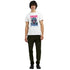 Male model wearing white Monkey DJ graphic T-shirt with pink and blue artwork.