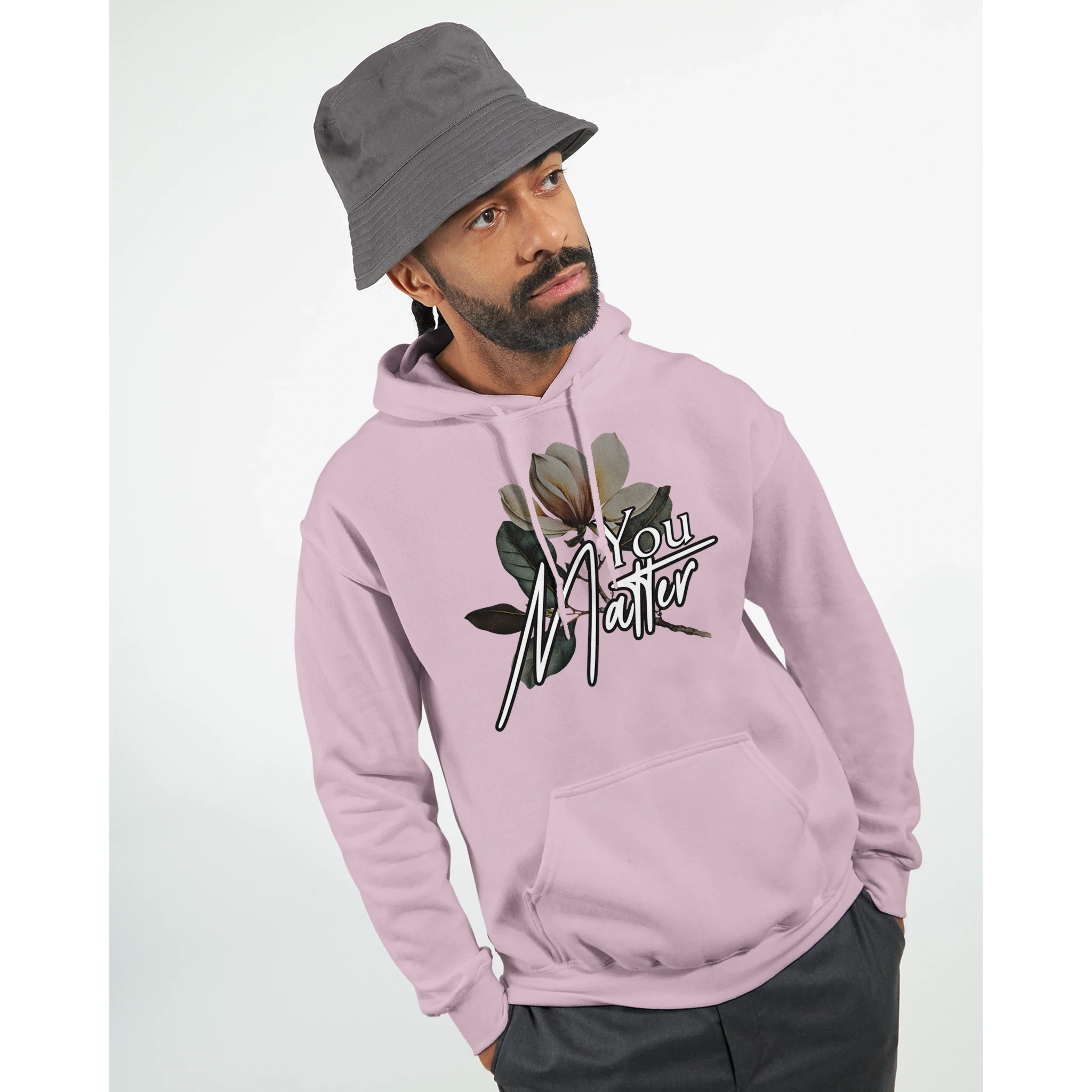 Male model in pink hoodie with You Matter slogan and floral graphic, front kangaroo pocket.