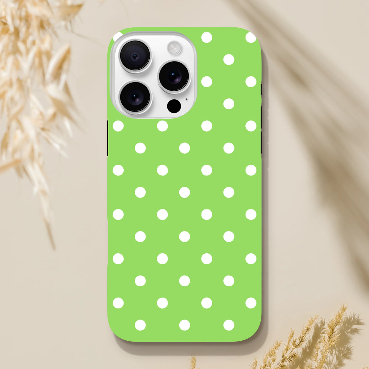 Green & white polka dot tough iPhone case with shock-absorbing TPU core and dual-layer protection for daily drops.
