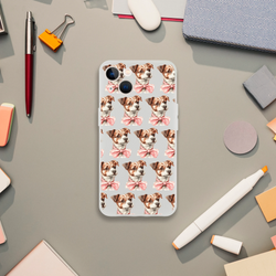 Transparent iPhone case featuring a repeating pattern of cute dogs with pink bows on a light gray background.