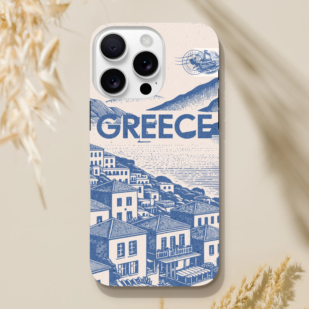 Vintage Greece tough iPhone case featuring a blue Mediterranean village illustration and airmail stamp design.