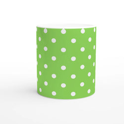 Vibrant green ceramic mug decorated with white polka dots. Spotty coffee cup design for daily coffee, tea, or gifting.