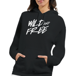 Woman in black 'Cute Wild And Free Hoodie' with bold white 'WILD AND FREE' slogan on chest.