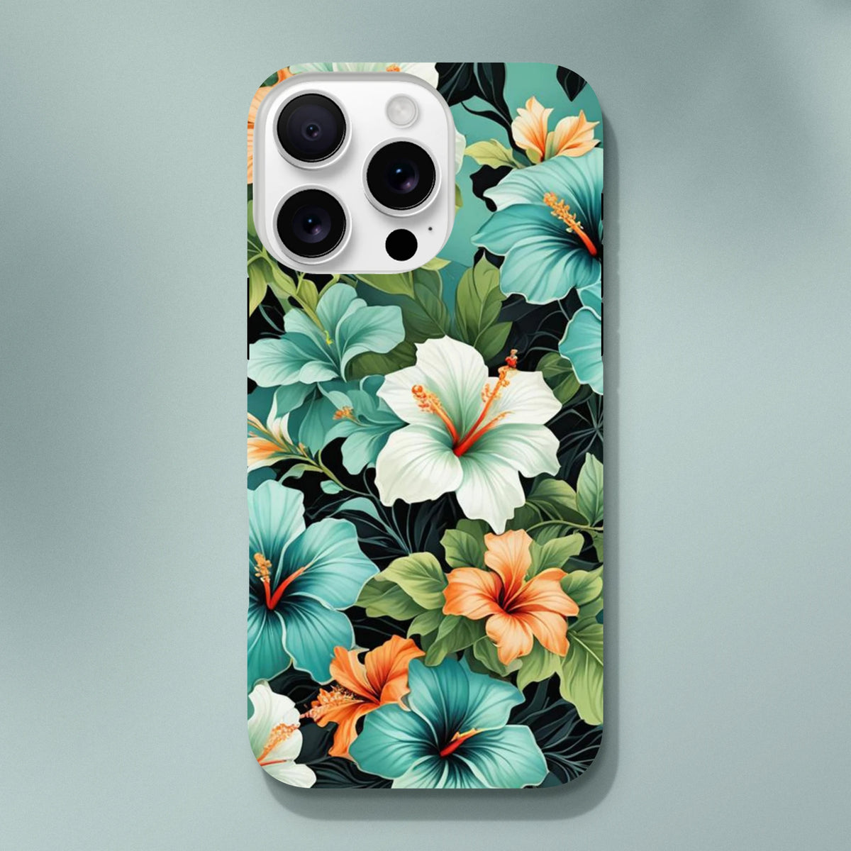 Tropical hibiscus phone case featuring teal, white, and orange flowers with lush green leaves on a dark background for shock absorption.