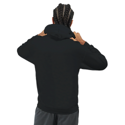 Man with braids adjusting the hood on a plain black streetwear pullover viewed from behind.