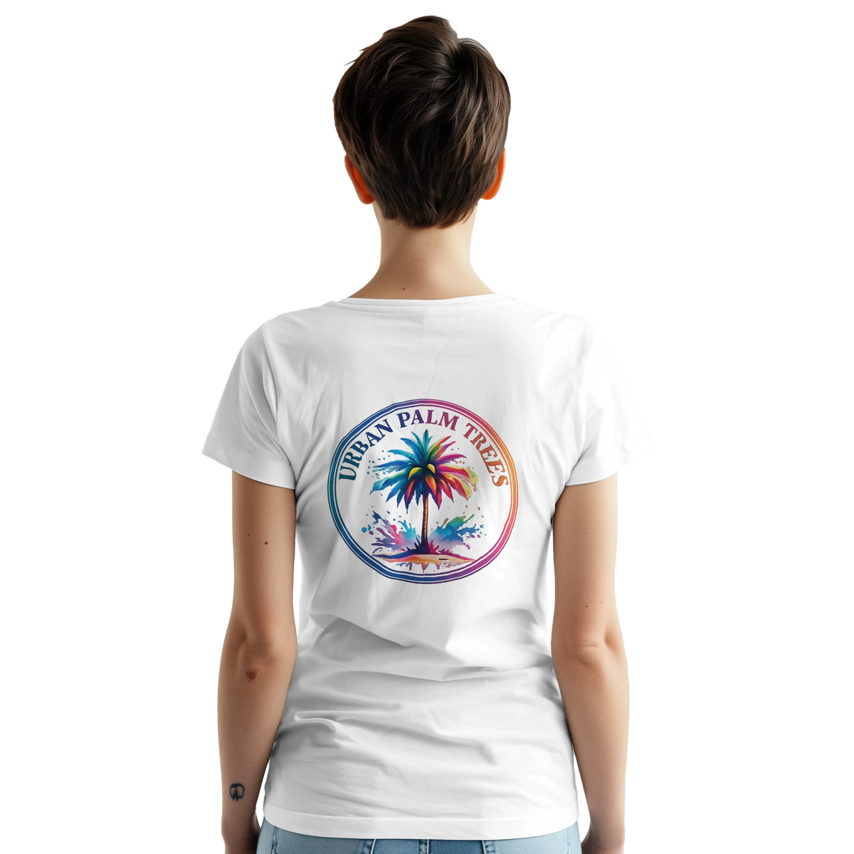 Back view of a woman wearing a white vintage-inspired palm tree graphic tee with a circular rainbow design.