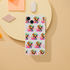 Slim frosty transparent iPhone case featuring a repeating colorful dog wearing sunglasses design for iPhone 13–16.