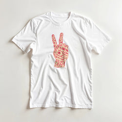 White women's graphic tee with pink peace sign hand design, short sleeves.