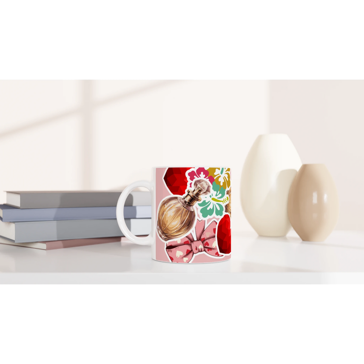 Retro ceramic coffee mug featuring a perfume bottle, colorful floral print, and coquette pink bow design on a white desk.
