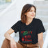 Woman wearing black Cherry Blaze graphic T-shirt with cherries and bold red lettering.