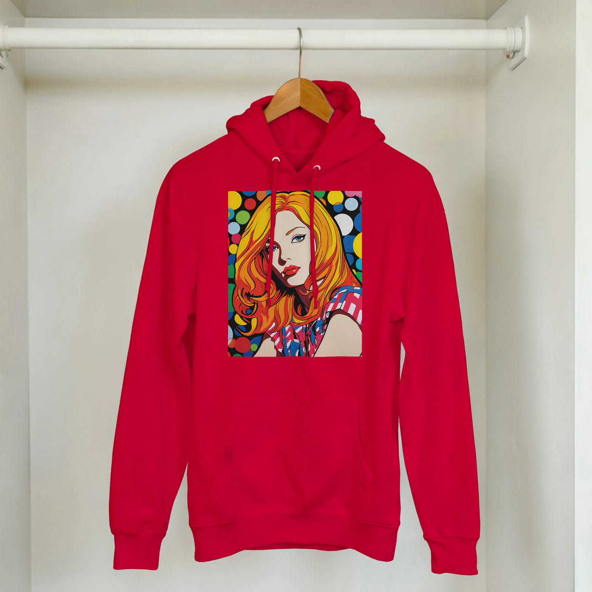 Red hoodie featuring a colourful retro pop art print of a blonde woman with polka dots against a black background.