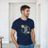 Man wearing a navy Good Vibes Only slogan graphic T-shirt with a floral wreath design.