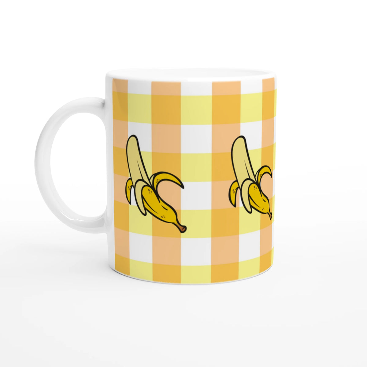 Banana-gingham ceramic mug with yellow checks and banana illustrations, a charming cottagecore coffee cup