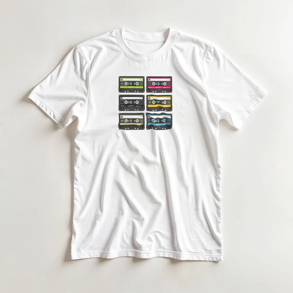 White men's t-shirt featuring six colorful retro cassette tape illustrations for vintage 80s music streetwear.