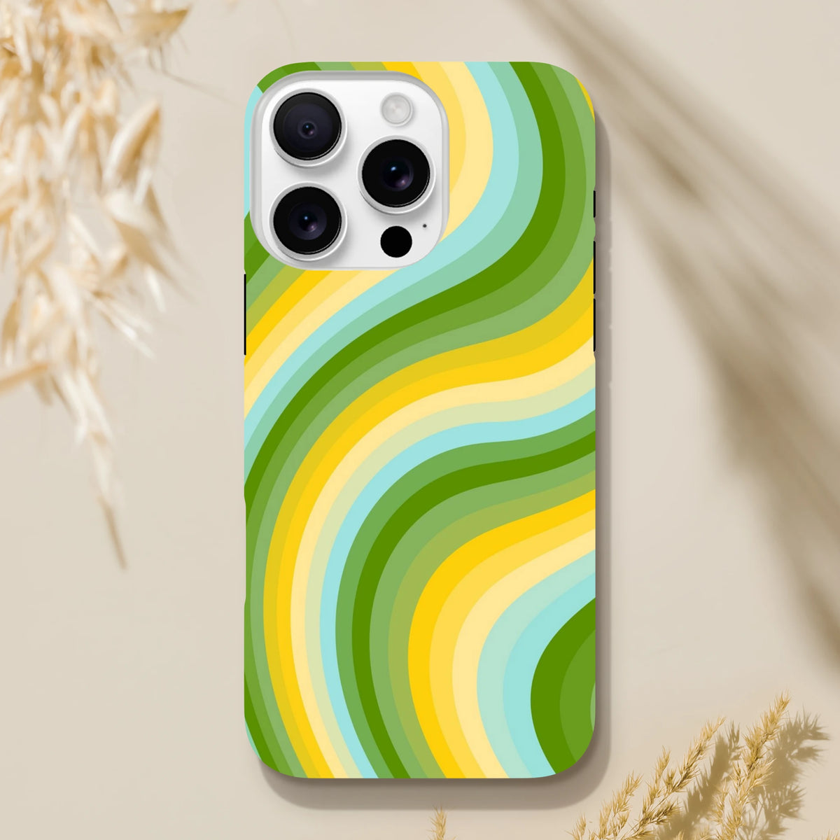 Green and yellow retro wave iPhone case with bold wavy stripes for Y2K streetwear aesthetic protection.