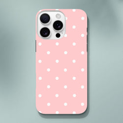 Pastel pink iPhone case with white polka dots. Cute tough protective cover featuring shock-absorbing TPU and dual-layer frame for dropped phones.