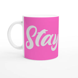 Pink Stay True mug with white handle and white script slogan on ceramic coffee cup.