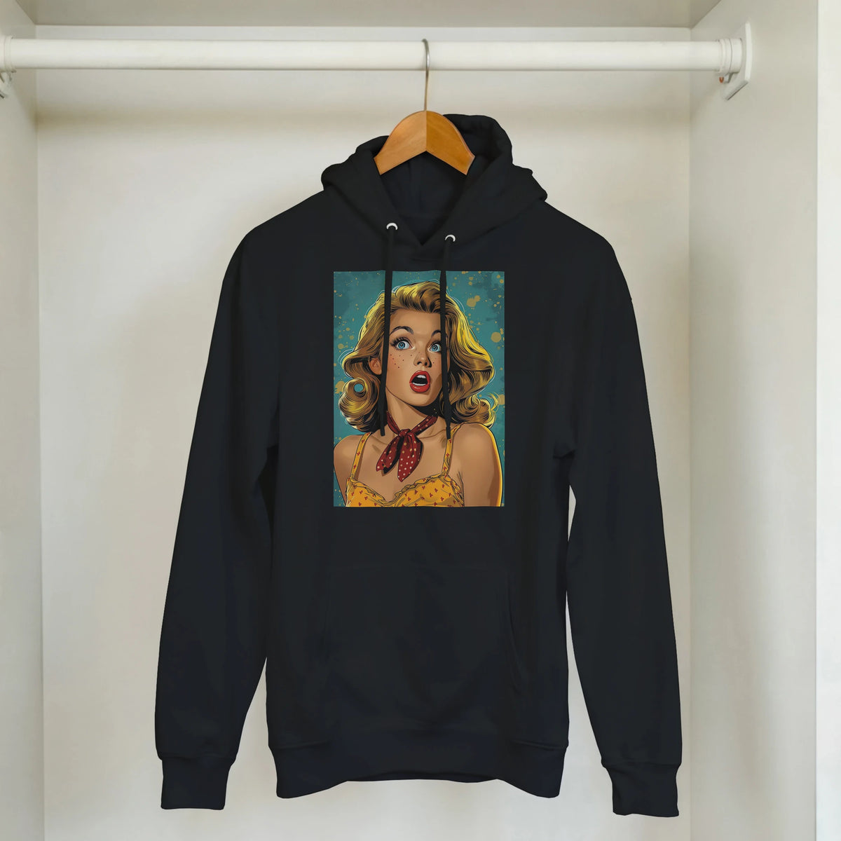 Black hoodie featuring a retro pin-up pop art woman graphic. Vintage streetwear pullover with bold comic-style blonde illustration.