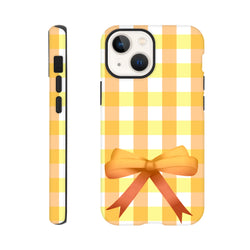 Yellow gingham iPhone case with a 3D orange bow. Vintage grid pattern tough cover for iPhone 13-16. Cute coquette street style phone accessory.