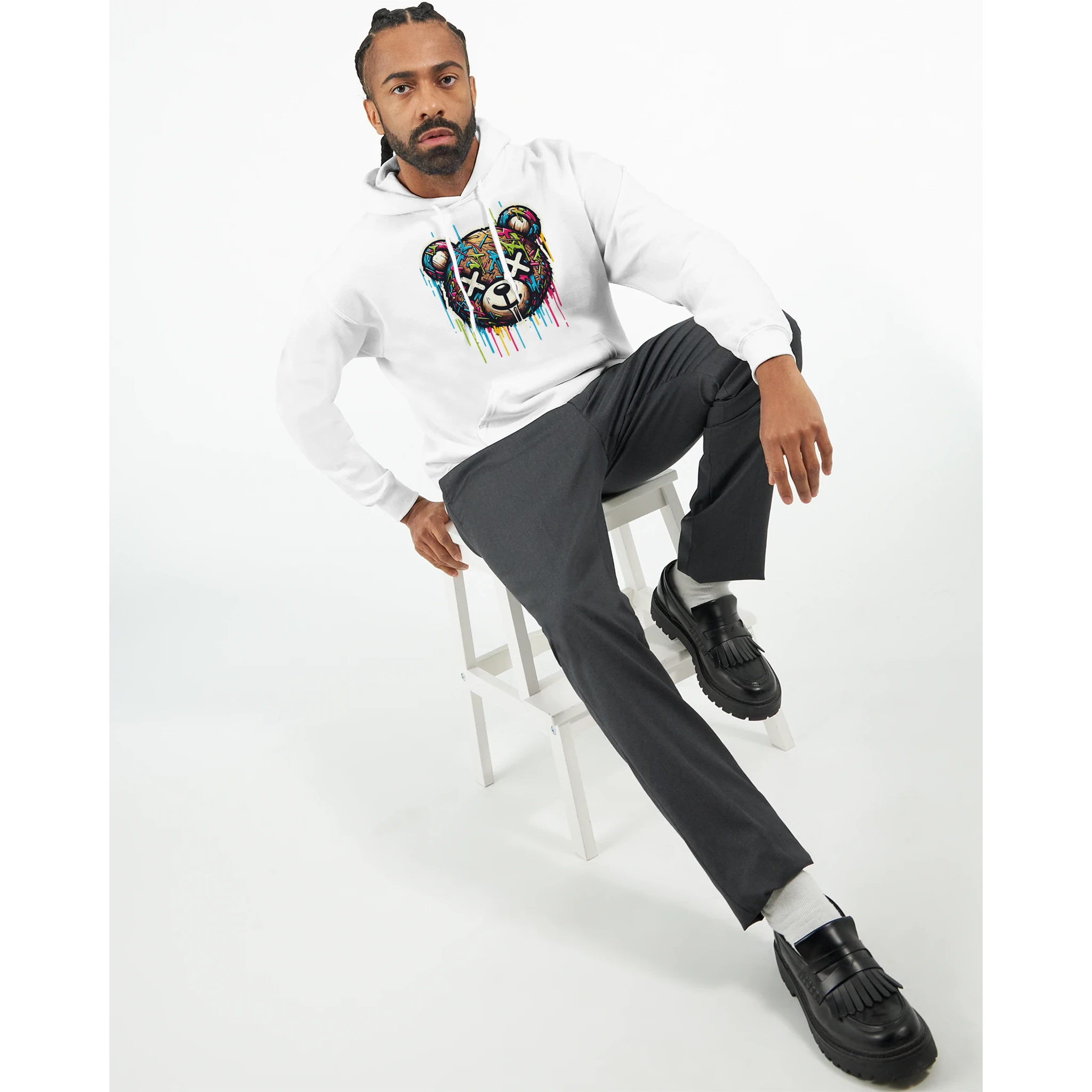 Male model in white cotton blend Teddy Bear Hoodie with colorful bear graphic, casual streetwear style.