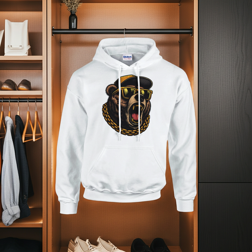 White hoodie with a bear graphic design hanging in a wardrobe.