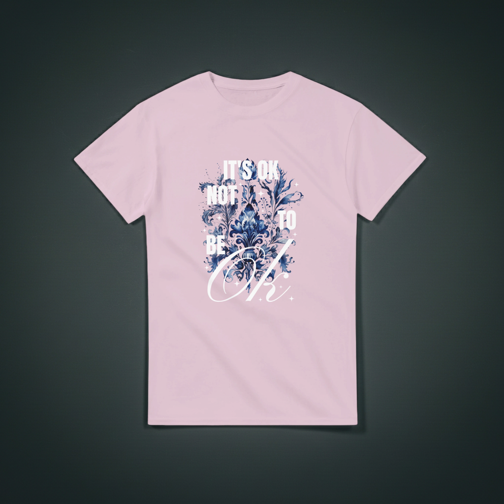 Pink t-shirt with floral design and text on a dark gray background