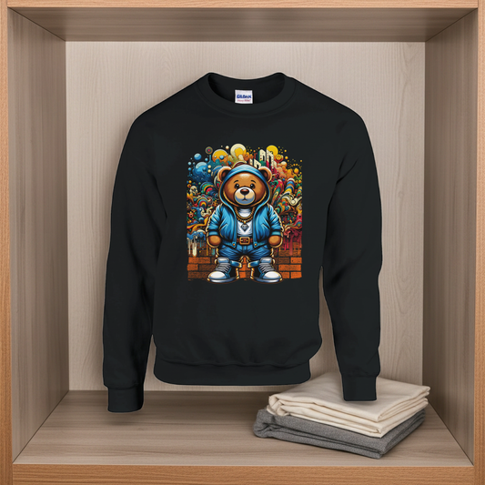 Black sweatshirt with a colorful bear graphic on a wooden shelf