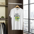 White t-shirt with 'Lemon Quencher' design on a hanger in a room with a window.