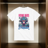 White t-shirt with a colorful monkey graphic and 'Future Beats' text hanging on a rack.