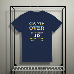 Navy blue t-shirt with retro video game text design on a rack.