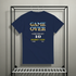 Navy blue t-shirt with retro video game text design on a rack.