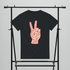 Black t-shirt with red peace sign design on a gray background