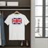 White t-shirt with British flag design hanging in a closet.